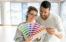 Couple looking through paint swatches